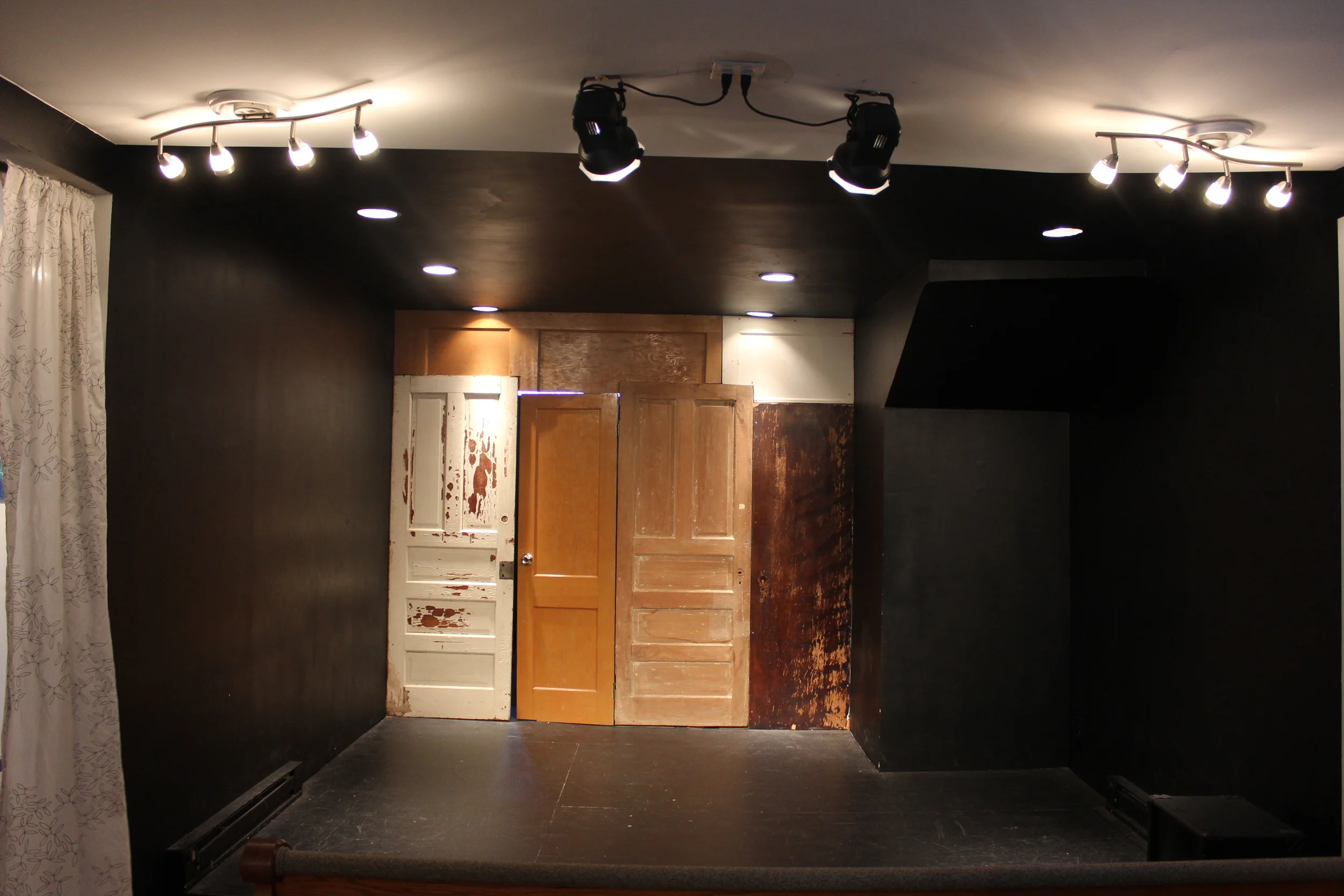 View of stage and door to backstage "green room" area.