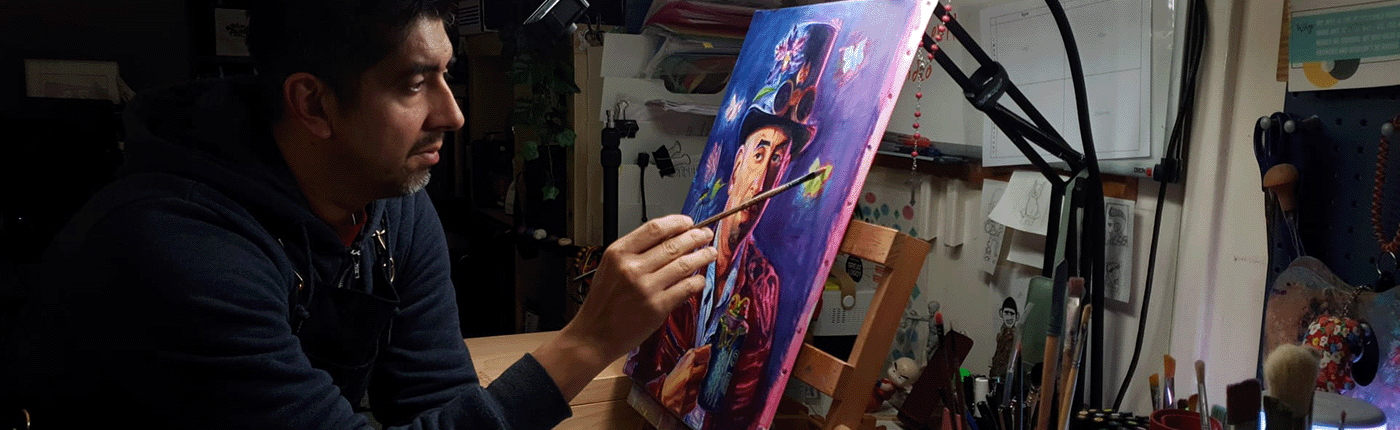 Alexgringo at his desk working on a self portrait