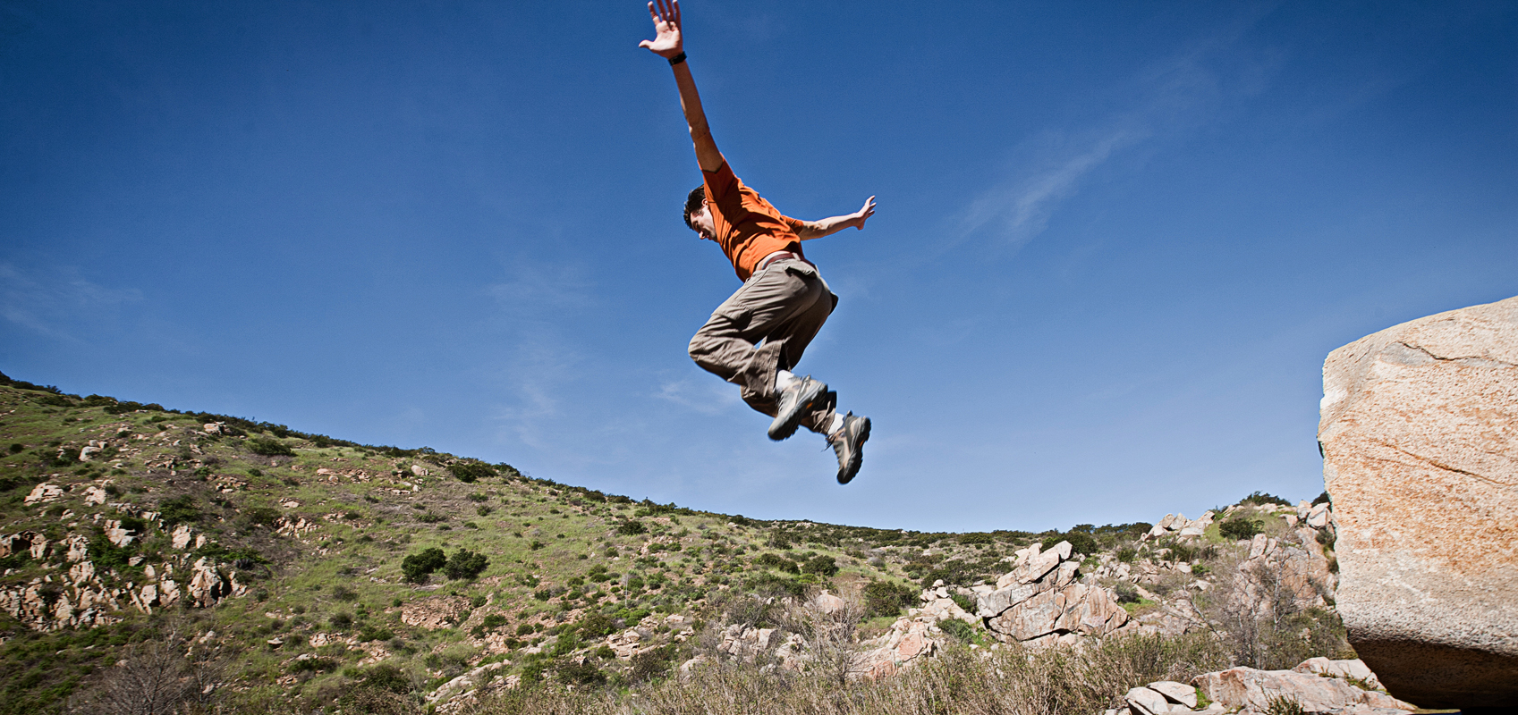 Free runner jumping of a huge rock. san diego commercial photography, san diego commercial photographer, southern California commercial photographer, California commercial photographer