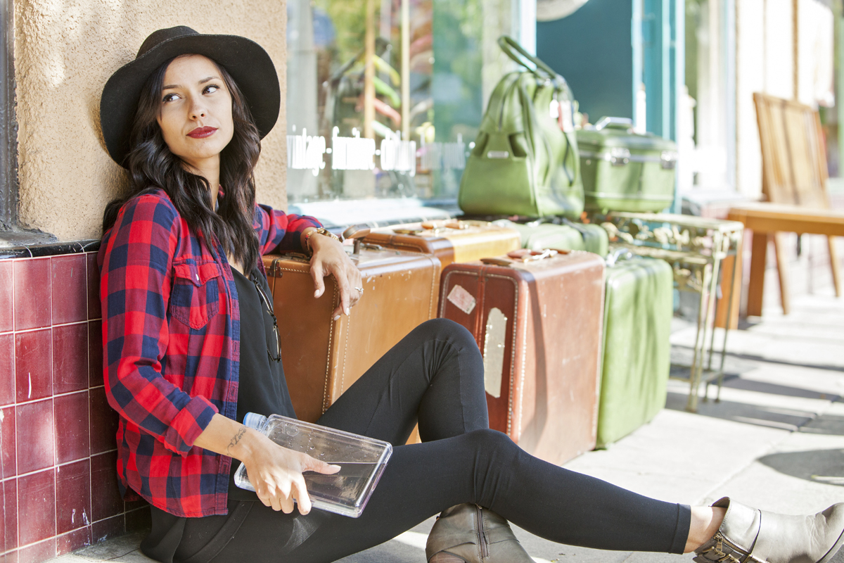Attractive hipster with vintage luggage. San Diego lifestyle, product and advertising photographer Jason Ward Studios.