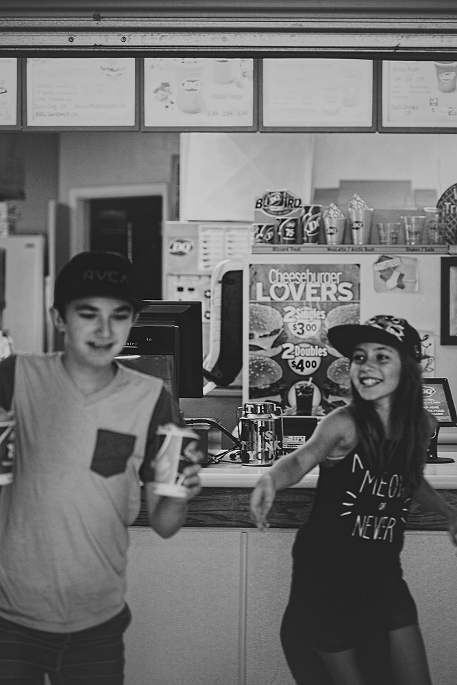 Not in focus with me laughing as I'm trying to take this, Ty is running away from the pick-up counter with both ice-creams. Brielle, trying to catch-up. 