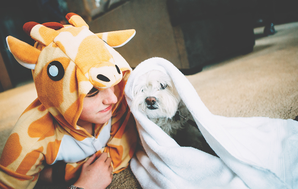 Keeping August warm with a blanket and a giraffe 