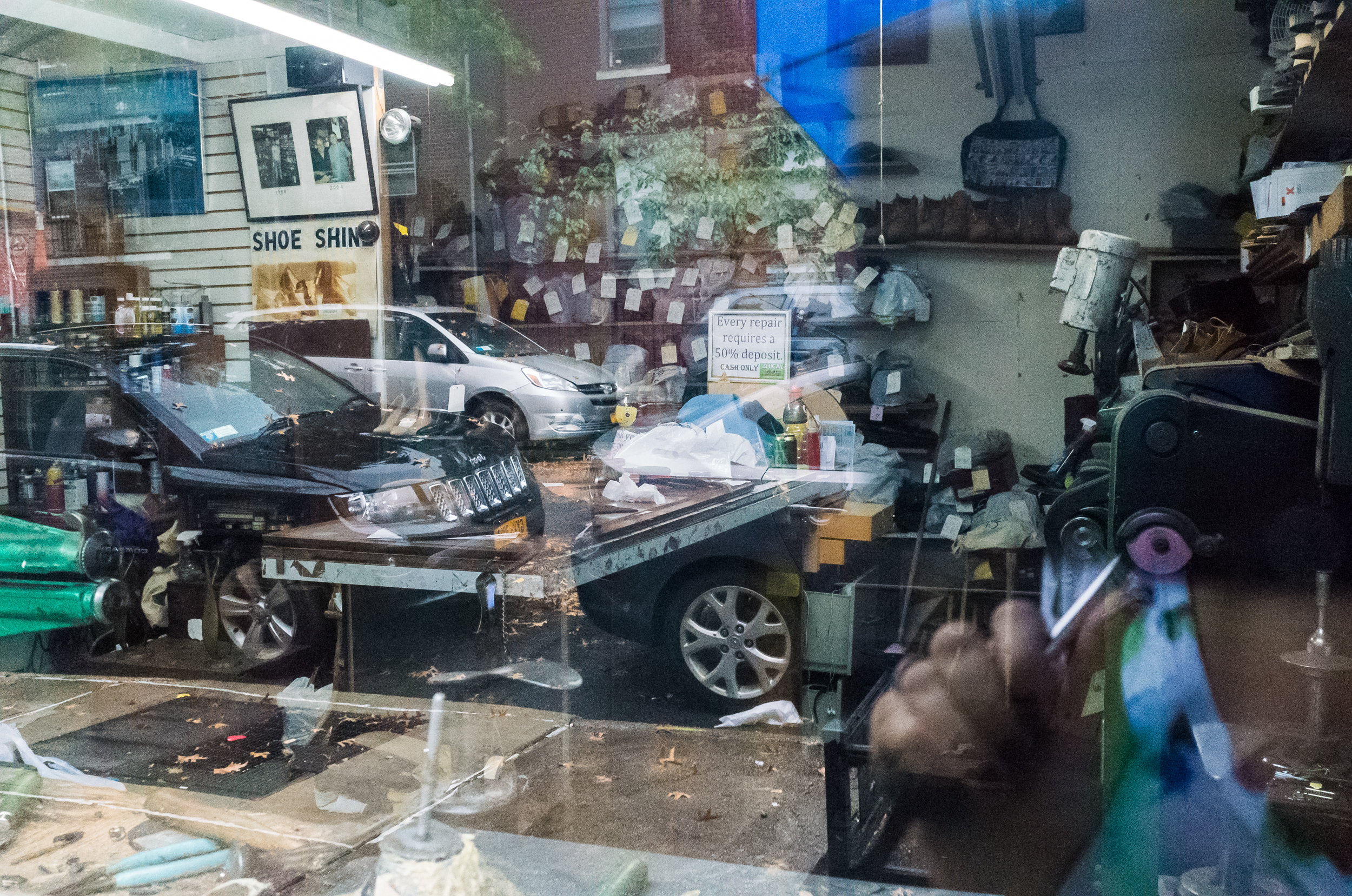 The inside of the shoe repair shop is the size of a small room.