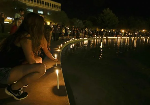 Students and supporters hold a candlelight vigil Wednesday at the University of Central Florida in Orlando, to honor Steven Sotloff, the second American journalist to be beheaded by the Islamic State group in two weeks. Sotloff attended the University of Central Florida between 2002 and 2004.