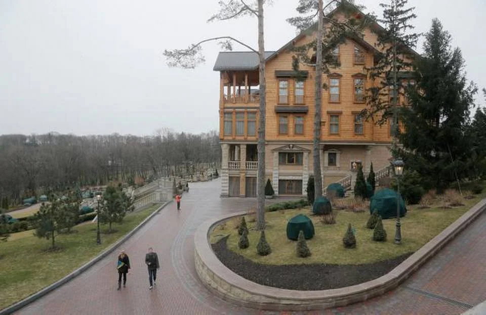 People walk in the grounds of Ukrainian President Viktor Yanukovych’s countryside residence in Mezhyhirya, Kiev region, Ukraine, in 2014. Nothing in the political world says “kick me” more loudly than an elected official’s huge house. American presidential candidates would do well to heed any warnings that they live lives of excess as this country hurtles toward 2016. Efrem Lukatsky Associated Press file.