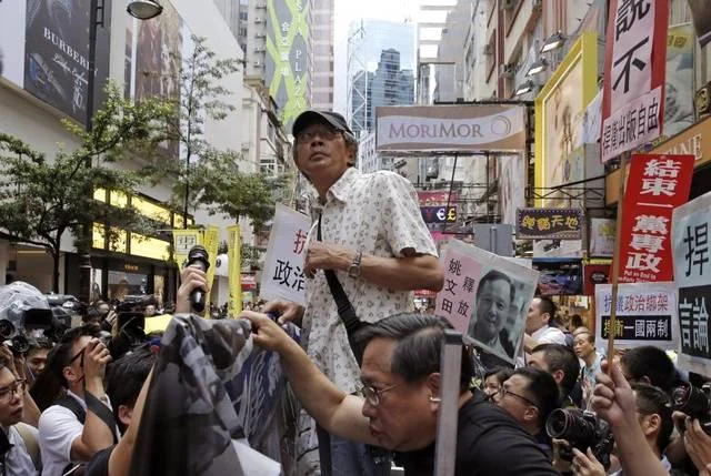 Freed bookseller Lam Wing-kee speaks to pro-democracy protesters in front of his book store in Hong Kong on June 18. He says he spent months in detention by mainland Chinese authorities for books critical of China’s Communist leadership. Kin Cheung The Associated Press