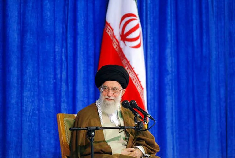 In this picture released by an official website of the office of the Iranian supreme leader, Supreme Leader Ayatollah Ali Khamenei attends a meeting with a group of school teachers in Tehran, Iran, Wednesday, May 9, 2018. Khamenei has challenged President Donald Trump over America pulling out of the nuclear deal, saying, "You can not do a damn thing!" a day after Trump announced he was renewing sanctions on Iran. 