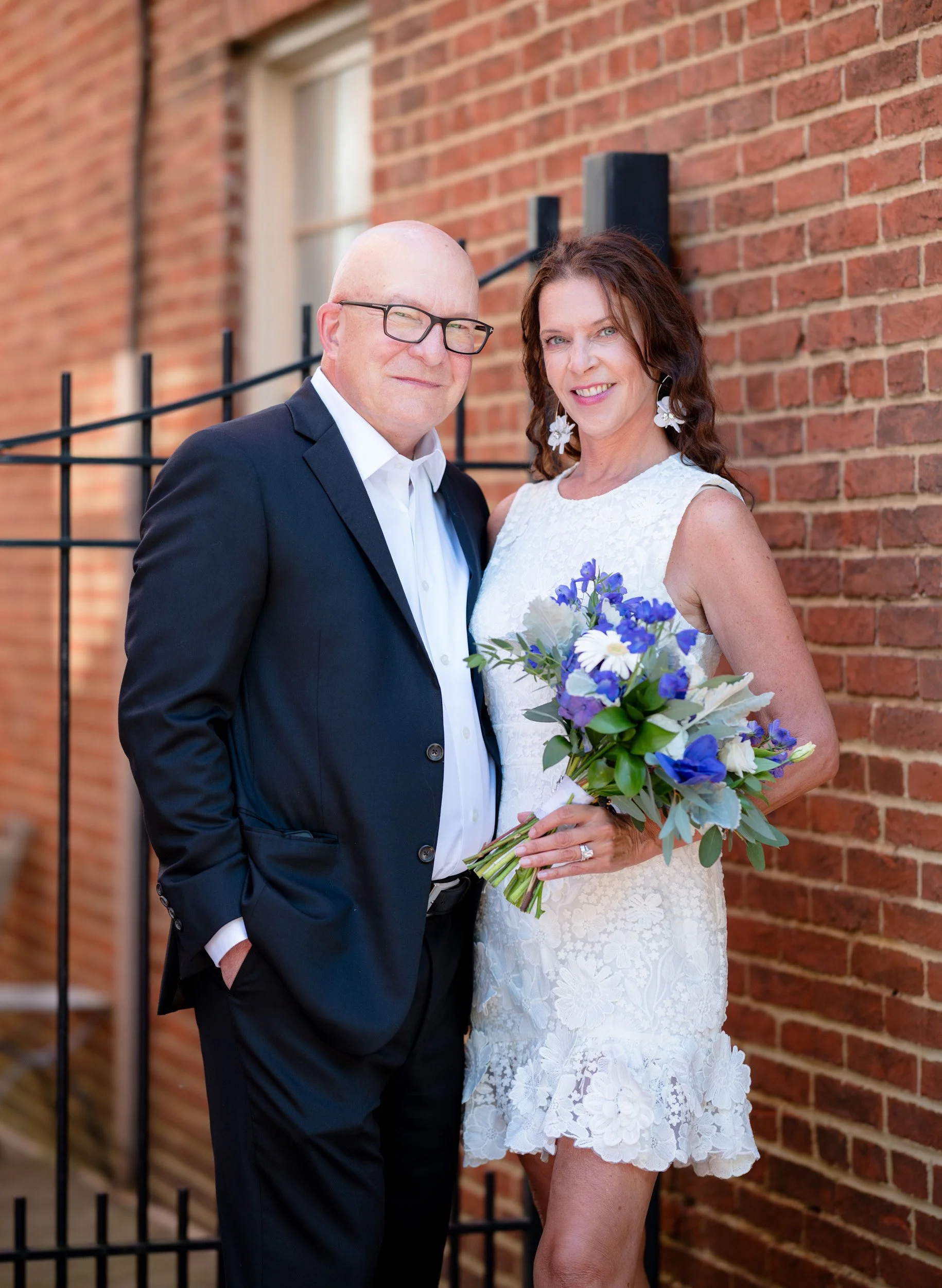 Annapolis civil court wedding couple portrait with brick wall backdrop in downtown Maryland