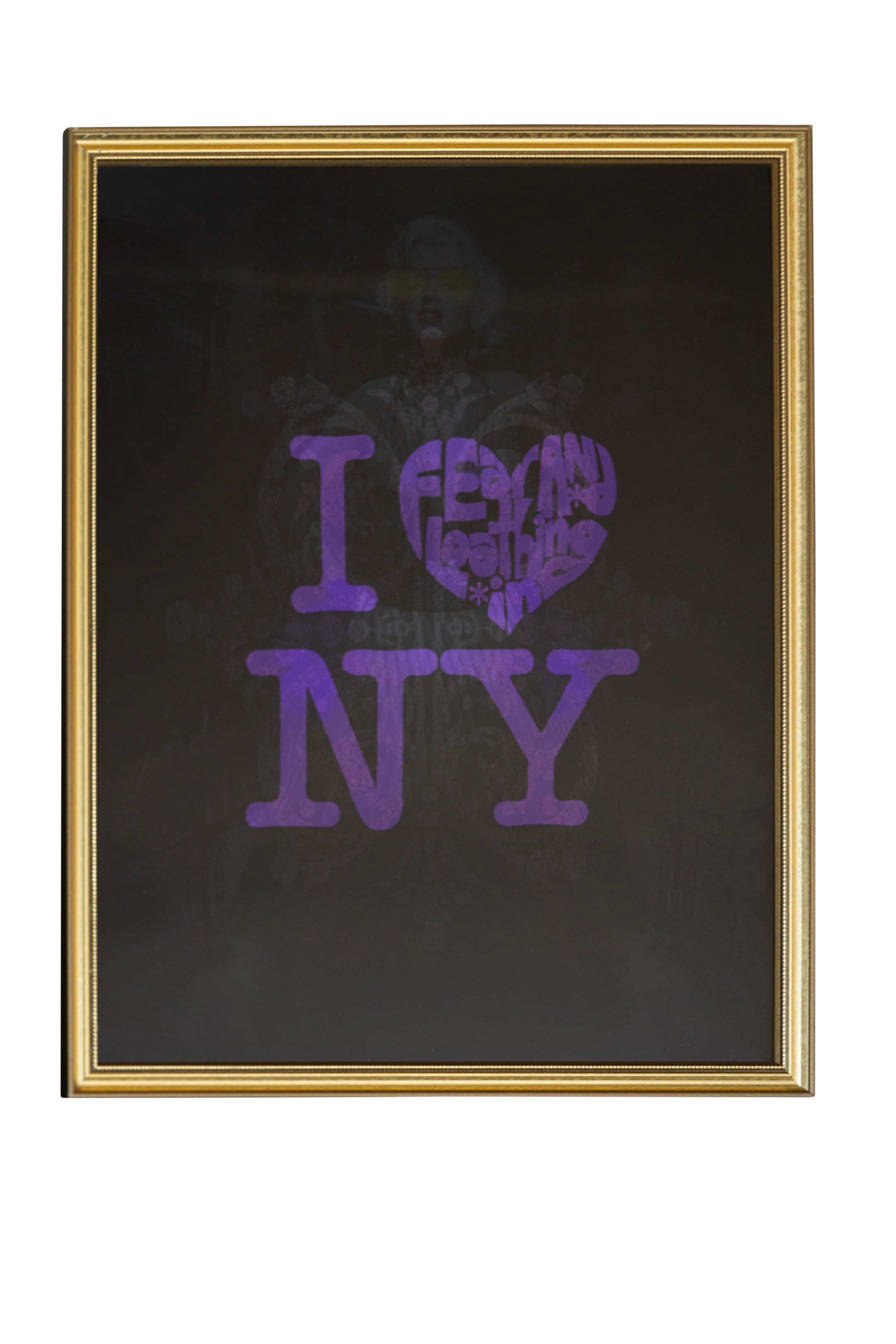 Framed blackboard with the words "I ♥ NY" in purple, with the heart filled with words and symbols.