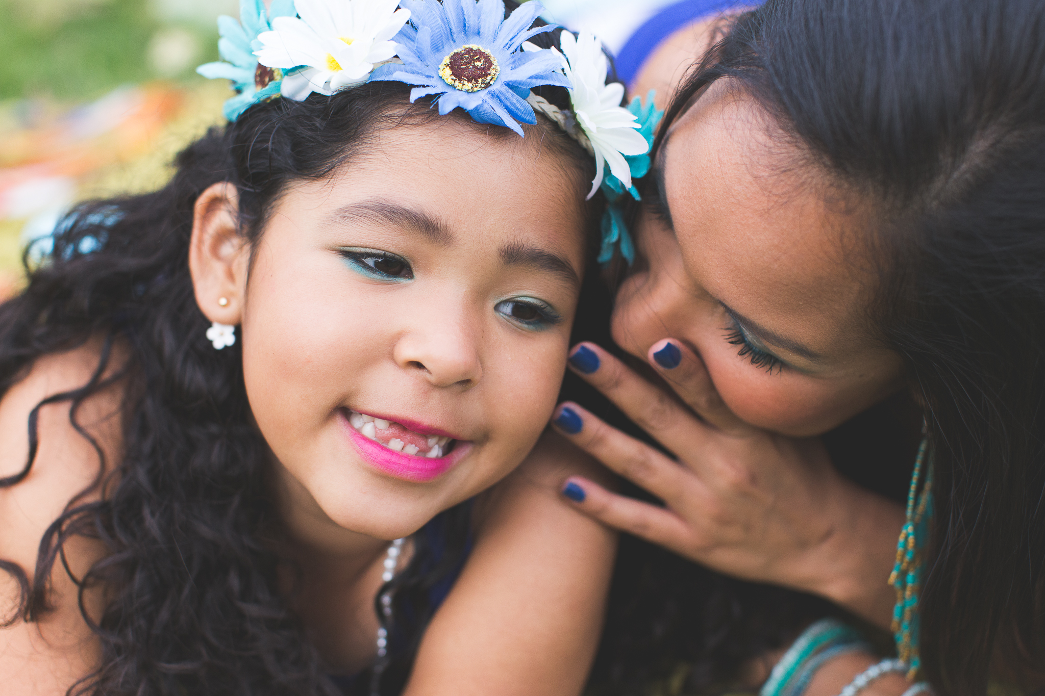 Mommy and daughter sharing some sweet whispers