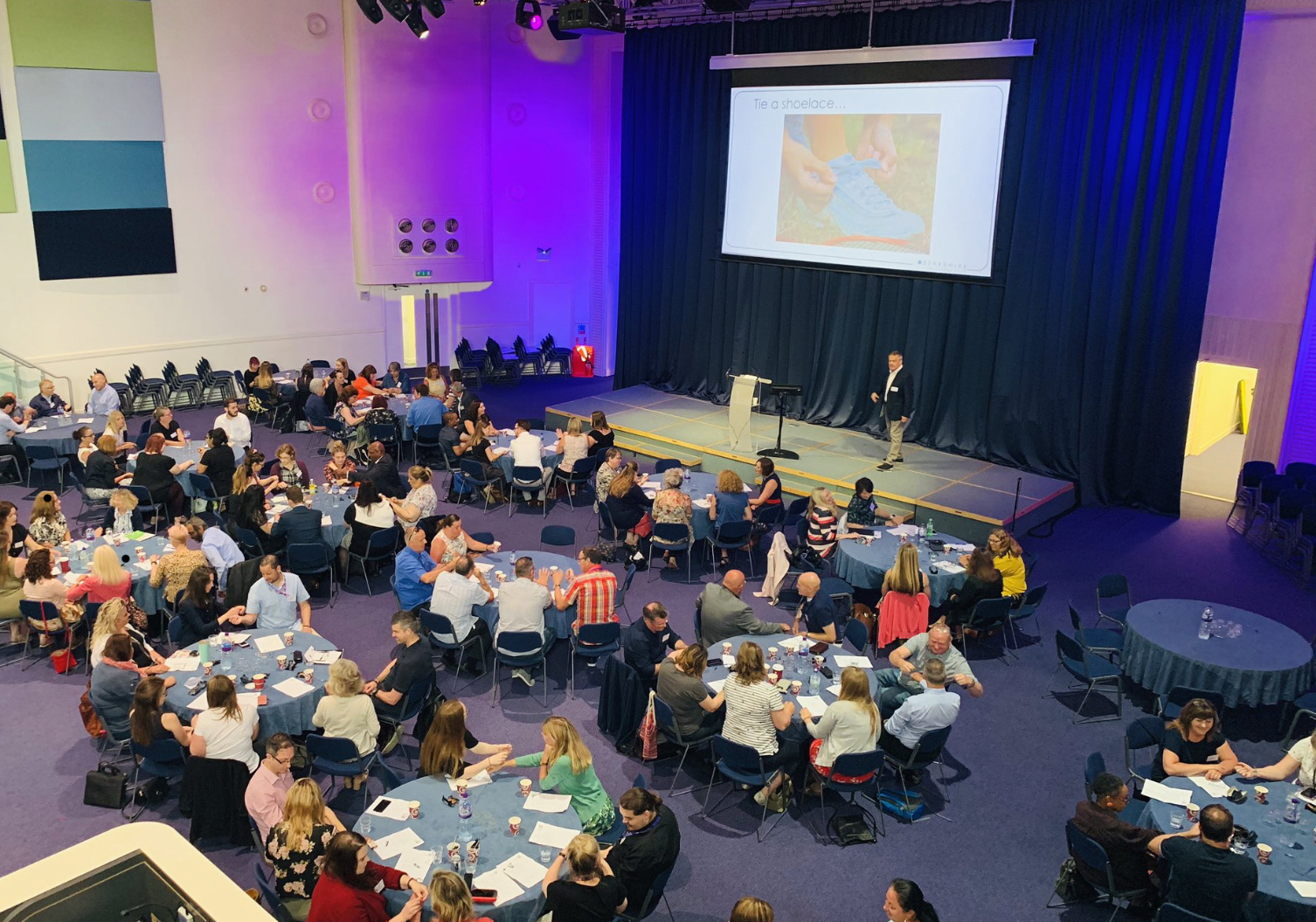 delivering a keynote speech to a conference of 200 people. Winchester, UK, July 2019