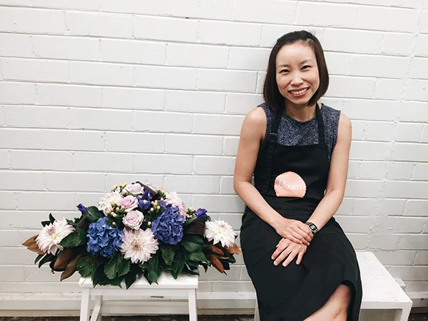Grace Tay with her creation of a flower bouquet