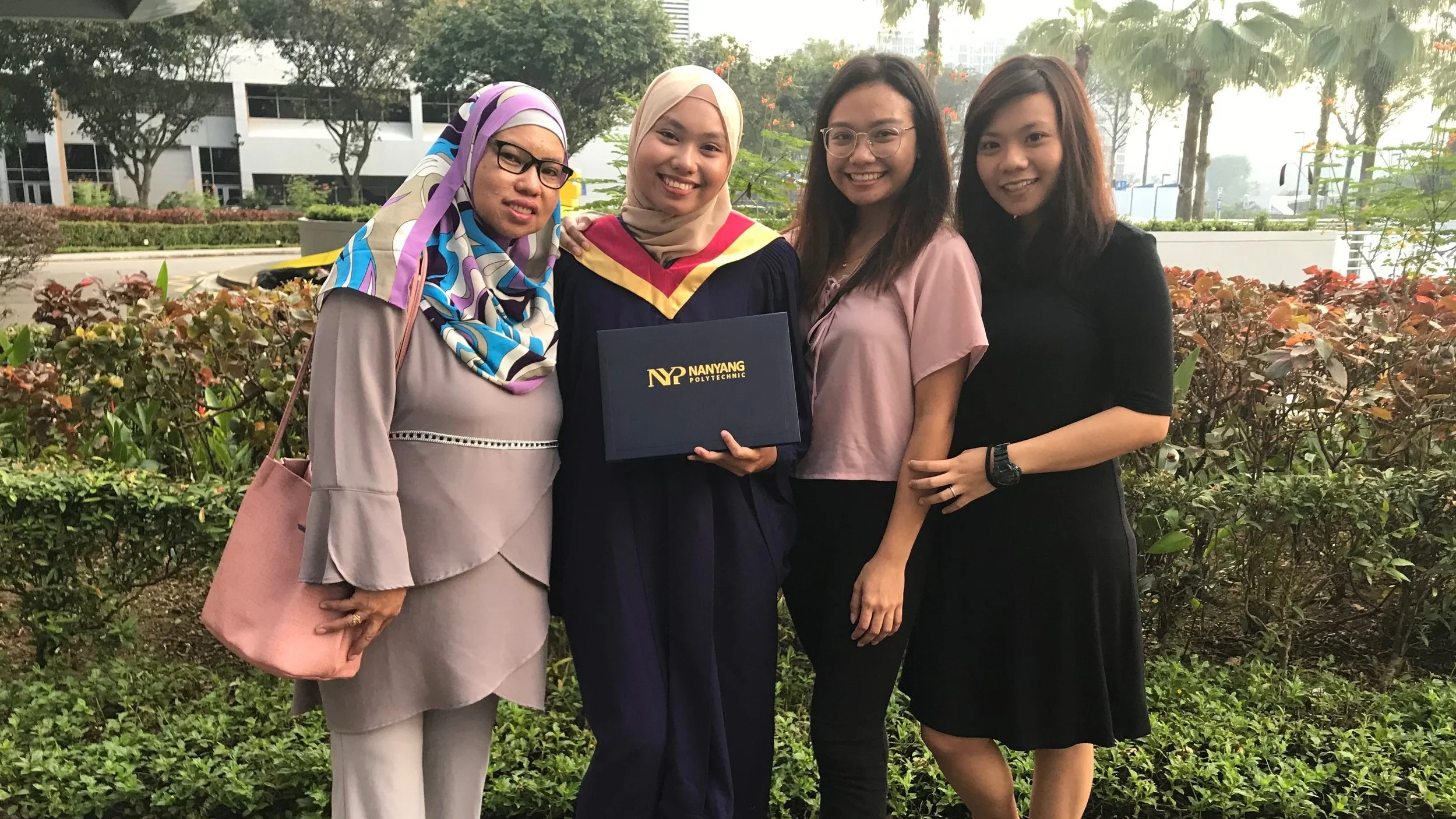 Syarifah (second from left) with her family at her graduation