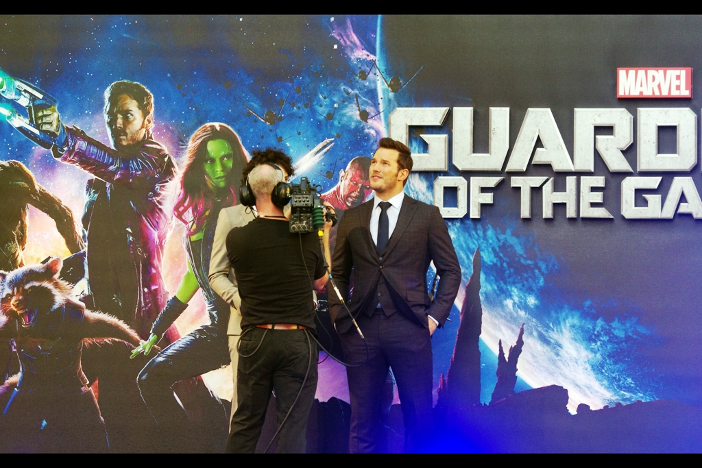 "The suit is sharp, but it's hard to look heroic without one or two laser-blasting guns to back it up". I feel like that every time I'm caught in public without at least one camera over one shoulder.