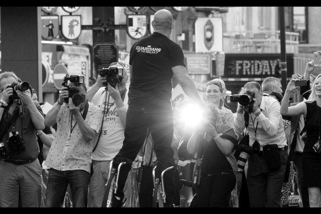 Meanwhile, the Mighty Vin Diesel has arrived, wearing some kind of kangaroo/moonboot things. He's remarkably adept at wearing them, even signing autographs leaning into the crowd. (I meanwhile am taking notes as to whether they might give me that much-needed height advantage at premieres that I've been looking for)