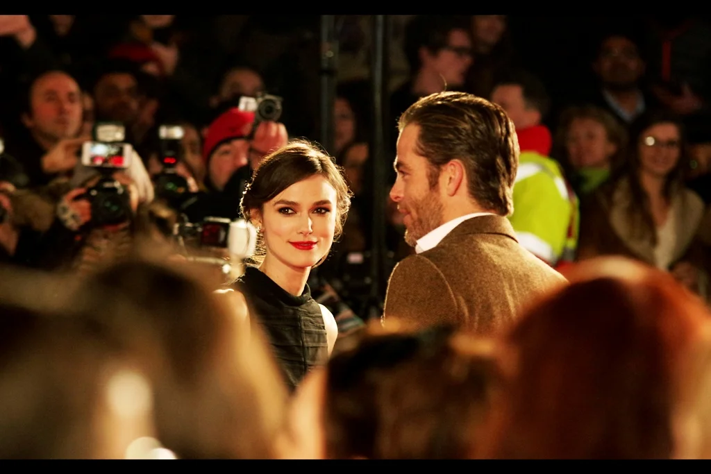 I've never seen that expression on Keira Knightley's face before!! ... I think they call it a genuine smile? (I've seen her pout and it's pretty spectacular to behold, but a smile is great).