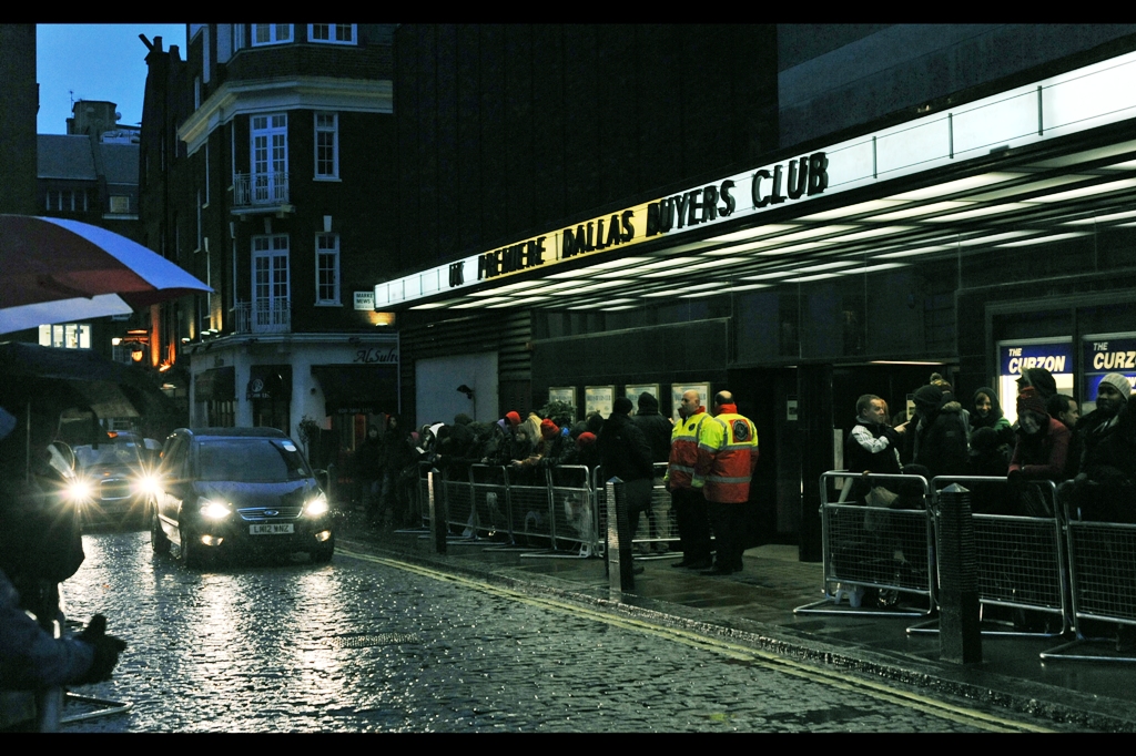 I've been standing here for an hour but it's cold and wet enough that the Spanish (?) couple standing near me have left, presumably to do the smart thing and head indoors and buy a 30 Seconds To Mars album and The Lincoln Lawyer on DVD and/or Bluray (or download both in iTunes, I guess). I have inherited their front row spot, which means I've got a better view. Of passing traffic, at this point