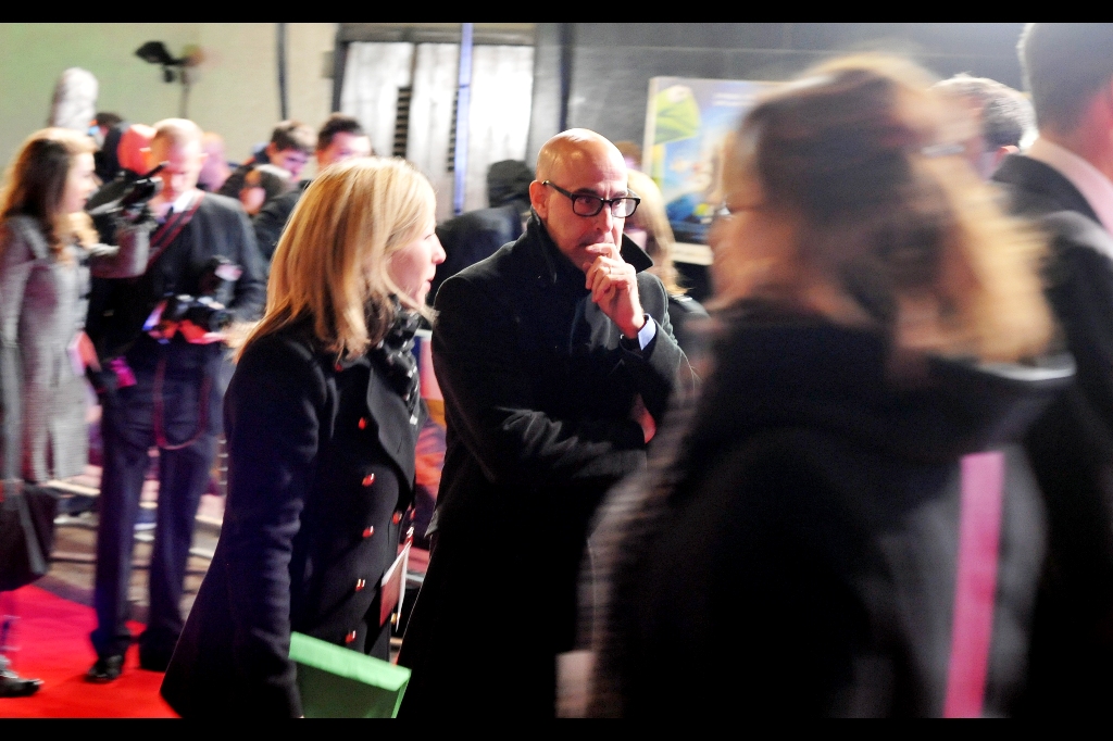 They must be deep and mighty thoughts if Stanley Tucci is having them in the middle of a Muppets premiere. Hopefully something more deep than what I'm thinking, which is : I'm cold and that's an awesome looking overcoat he's wearing.