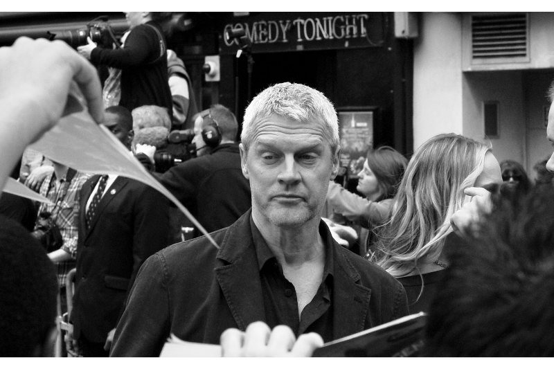 "Hmmm... I don't think this is a clever work of fanfiction as much as it is a copy of the book 'Divergent'. Are you sure you should be asking me to sign it?" Director Neil Burger looks confused at how autographing stuff works..