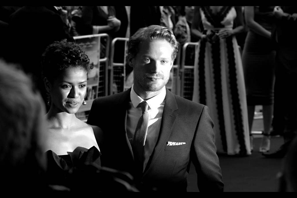 Gugu Mbatha-Raw and Sam Reid pose. Sam Reid, incidentally, was in (and at the premieres of.. I think) both Anonymous (2011) and The Railway Man (2013) . He's got a certain Tom Hardy vibe about him... insofar as he's wearing a suit, I suppose.