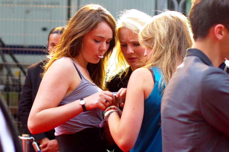 These three were struggling with a point-and-shoot camera on the red carpet moments earlier, but I wasn't able to get their attention and offer them assistance without risking being beaten up by Gerard Butler.