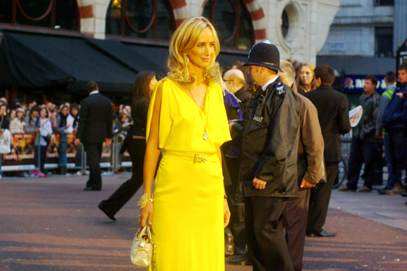 Exceedingly thin, slightly jaundiced and wearing a searingly yellow dress. My camera's autofocus seized up a little trying to find the contrast there. My main thought: eat a cough drop, lady- you need the calorie!