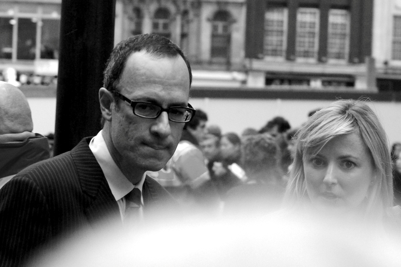 I don't know for sure, but I suspect this is director of 'HTLFAIP' Robert. B. Weide. But I've just checked IMDB and he doesn't really look much like him, so my new theory is he's flat-out pretending to be the guy just to be part of the premiere. (Damnit, that's MY idea!)