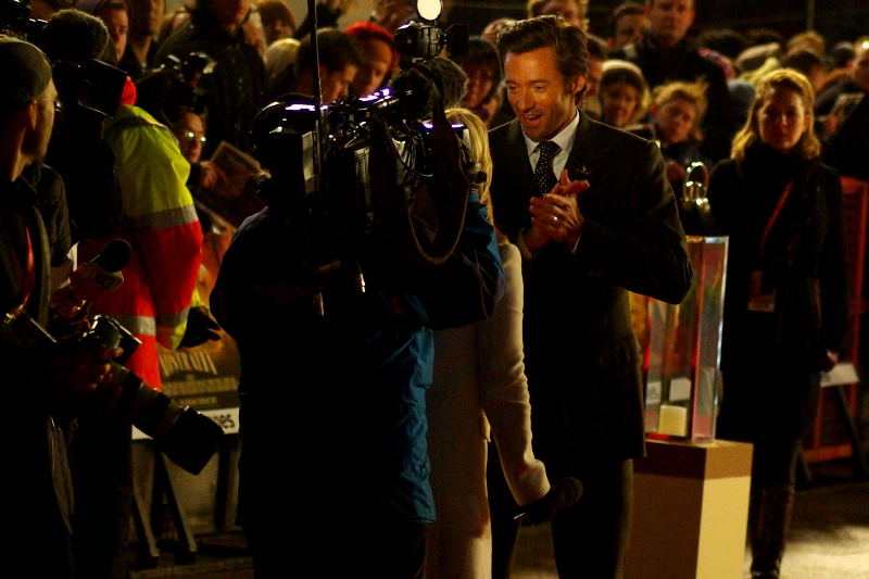 "Why, yes I'm flattered that you'd ask me to marry you when we just met. But not only I am wearing my wedding ring, but also my wife is, like, standing right over there" You tell 'em, Hugh Jackman.