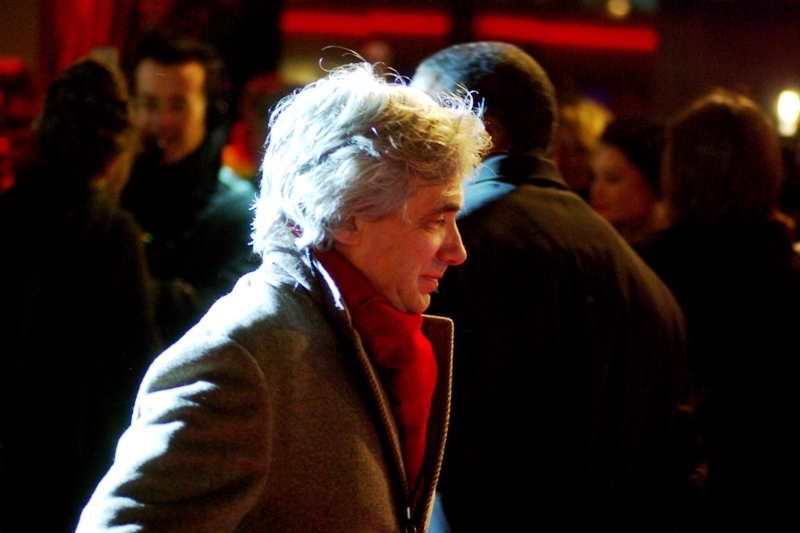 I have no idea who this is. But if you're wearing a red scarf on a red carpet, you have my attention on the grounds of cool minimalism.