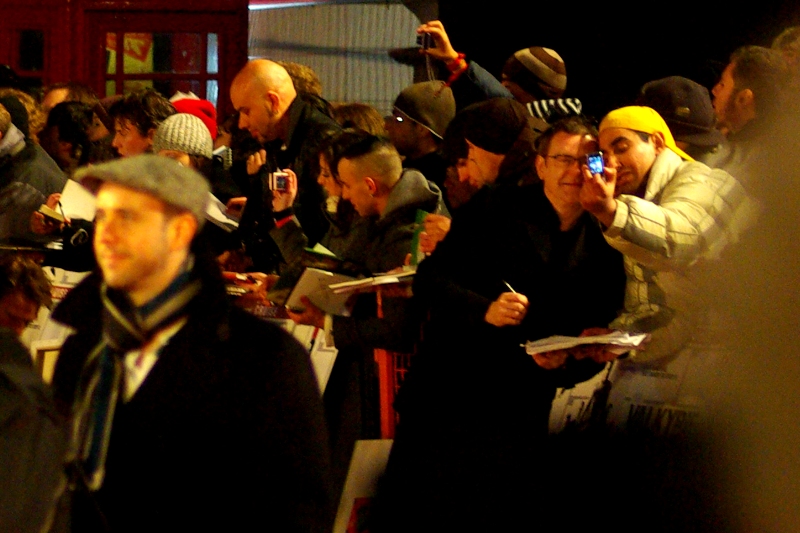 Yellow Cap Guy does what Yellow Cap Guy does best. And for this premiere he was in pole position, too. Well played, sir.