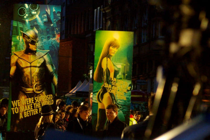 "Watchmen", as stated, was put into Time Magazine's top 100 novels of all time. The woman in the skin tight lycra bodysuit is therefore probably a metaphor.