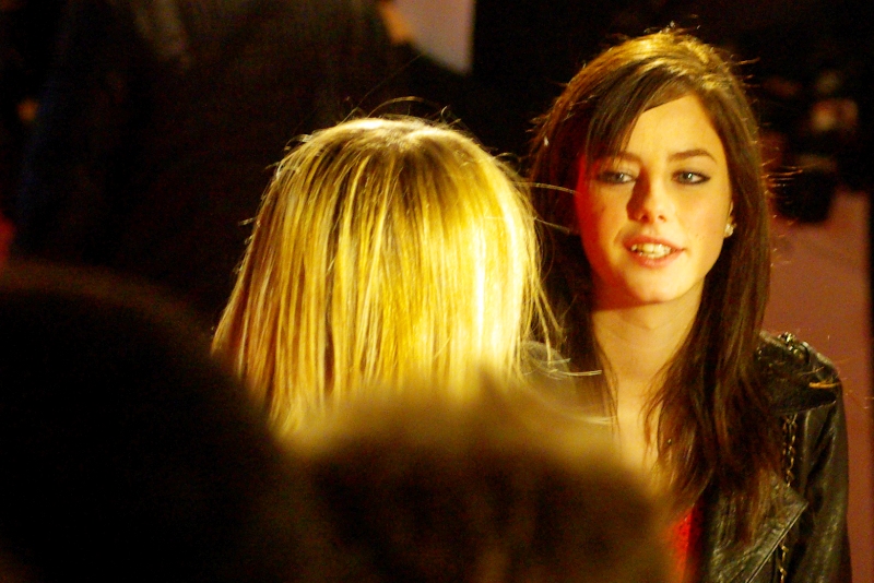 I have no idea who this is (as usual), but she was being interviewed. And the dude sitting next to her also being interviewed looked about twelve years old and had a brown hair afro. (I cropped him out of the picture because... obviously)