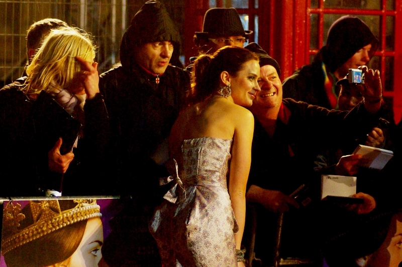 The Young Queen Victoria mingles with commoners. Not that I want to panic anybody, but Yellow Cap Guy was not in evidence at this premiere. Who knew he had strong republican sentiments?