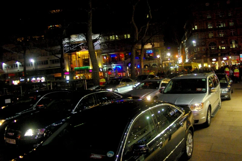 I was cold but after I went for a McDonald's dinner I decided to return and see if I could get any worthy shots. This photo, of the former red carpet area now turned into a parking lot for the stars' cars and drivers, kind of qualifies.