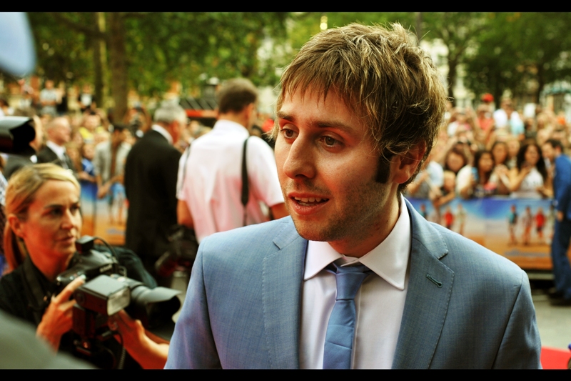 Similarly, James Buckley is also best known for being in The Inbetweeners Movie, The Inbetweeners TV Show and the Inbetweeners movie sequel. Oh, and a movie starring Shia LaBeouf, who is now best known for putting paper bags over his head and crying as a piece of installation art. So... you know... keep an eye on the tie. Once it comes off, he could go off the rails handily.