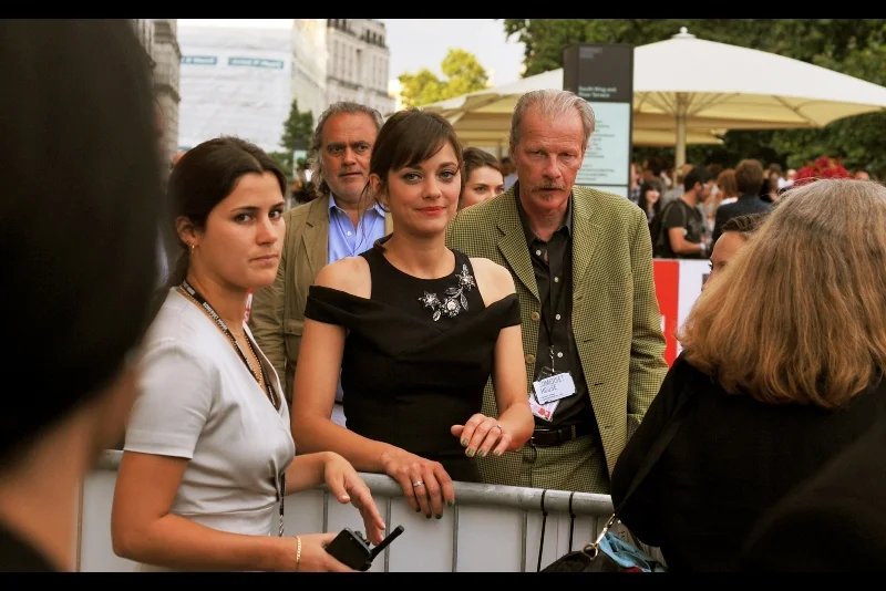 The lovely Marion Cotillard is all "yeah, I won an Oscar and am widely respected for my mastery of the craft of Acting, but sure I'll sign your Inception and Dark Knight Rises crap". (She wasn't like that... she was very friendly)