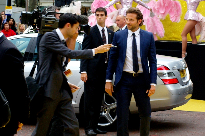 I'm not sure what's going on, but I suspect actor Bradley Cooper has been approached by a scalper to purchase tickets to his own premiere.