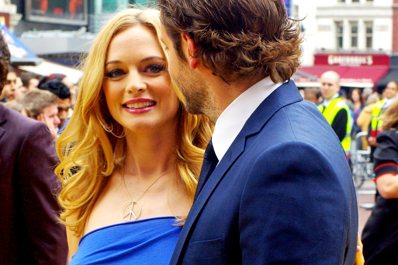 Heather Graham has a boyfriend (purple suit, to her right) and a leading man (blue suit, on her left). But I have eye contact. Won't you please tell me I have eye-contact???