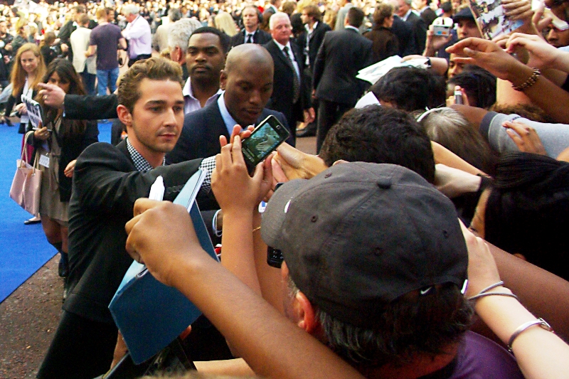 Shia LaBeouf has arrived and is signing autographs so efficiently he's overtaking Tyreese Gibson. It's possible that Shia's signing "Shia" or even "SLB" or maybe just a lazy sprawling "S", while Tyreese is signing his full name Tyreese Darnell Gibson, with associated titles, honorifics and personalised greetings.