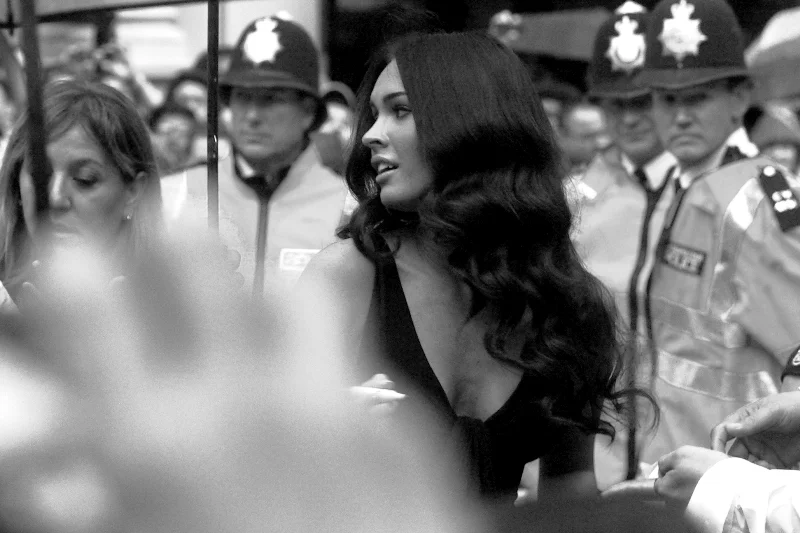 Once again, actress (or should I say Walking Magazine Cover) Megan Fox. The black and white conversion in this photo is due to the distractingly yellow jackets of the police in the background, in case you're reading the commentary instead of looking at the photo. Can one photo make a whole premiere worthwhile? Given the unforgivable autofocus issues to come in this journal, I'm saying yes.