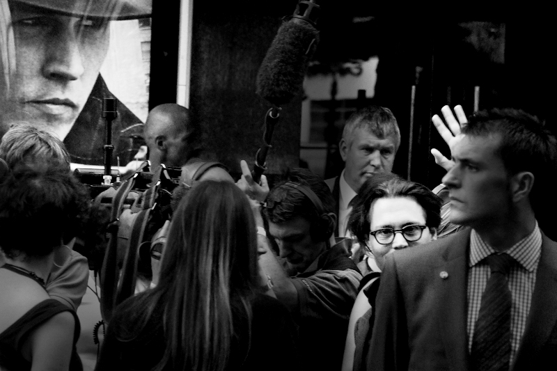 Possibly my favourite shot of the premiere. I call it "Prankster". Johnny Depp briefly makes light of his overly serious bodyguard's size and intense focus. He's probably protecting Johnny Depp AND democracy at the same time, Depp. Look at that focus!