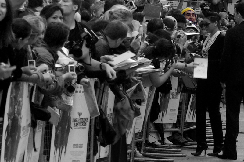 Finally, randomly, singer Rihanna showed up late with a huge van and an entourage and a driver who looked confused as to where he was and just idled there for so long that close-up photos of the star were impossible. Still, here she is, right just to the right of Yellow Cap Guy's gravitational zone