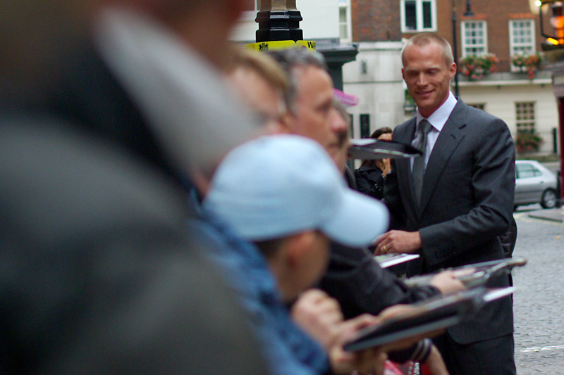 The face looked vaguely familiar - and my keen powers of observation noted people holding out DVD covers of the movies 'Wimbledon' and 'The Da Vinci Code' for him to sign. That (as well as people calling out 'PAUL' and there being a Paul mentioned in the movie poster) leads me to conclude this is Paul Bettany, the star of the film.