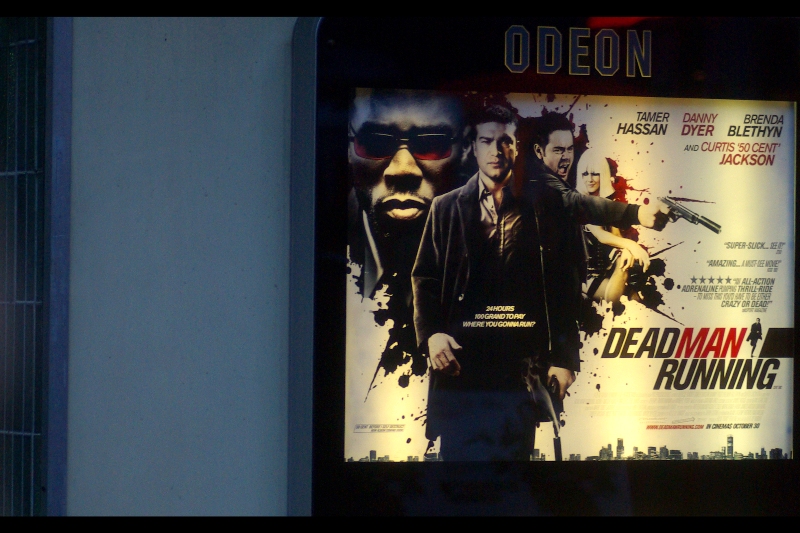 Movie poster. All I'm seeing is wordplay on the pre-existing film 'Dead Man Walking' in a non-sequel context so I'm yet to be impressed, but that's partly because I haven't photographed any celebs yet ... other than Yellow Cap Guy