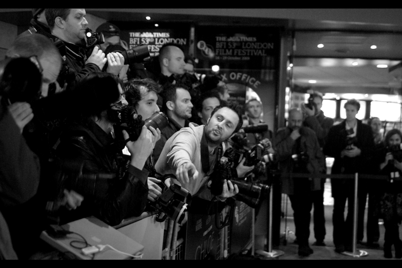 One of the Paparazzi says something to one of the other paparazzi. Possibly a jibe about then being a Pentax shooter, .. I wasn't really listening. But it was a moment