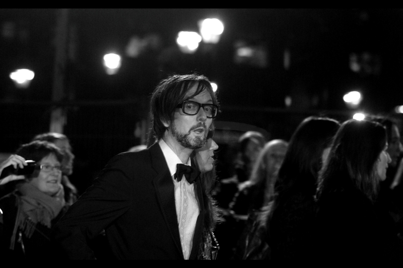 This is Jarvis Cocker, former frontman of the band "Pulp". Their song "Disco 2000" = Fantastic. "Common People" = even more so. And the Spoken word version of the latter by William Shatner? Is a real thing I'm not making up, and it attained a level of awesomeness that the world has rarely seen. I bought it. It's on my iPod.