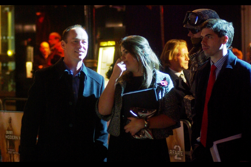 I have no idea who this is. But since the people at this event were generally either (1) r'n'b/rap stars (2) geeks (3) uncomfortable looking models in tight clothing (4) uniformed troops or (5) studio execs, I reckon this might be... will.I.am from the Black Eyed Peas?