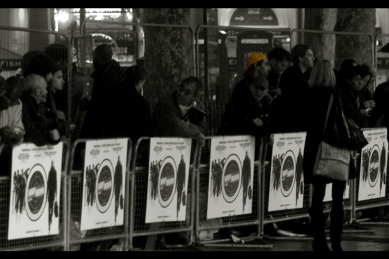 Spotted in the far distance : Yellow Cap Guy. His story is interesting, and so is that of Nikon D70 Guy, who I stood next to at yesterday's Call of Duty Premiere . There are some fascinating people who hang out at these premieres. Except me. I'm just standing here, pointing my camera. I can take or leave these things - indeed, I went to Harry Brown but will NOT go to New Moon. Sorry!