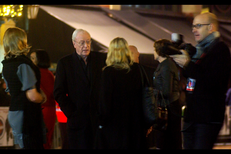 Sir Michael Caine alights from his vehicle, looking very Sir/Knight-like. Or… well… very Butler-like, given he's also Alfred the Butler in Batman. .. And a citizen vigilante in this film. (Approach him at your own risk, really!)