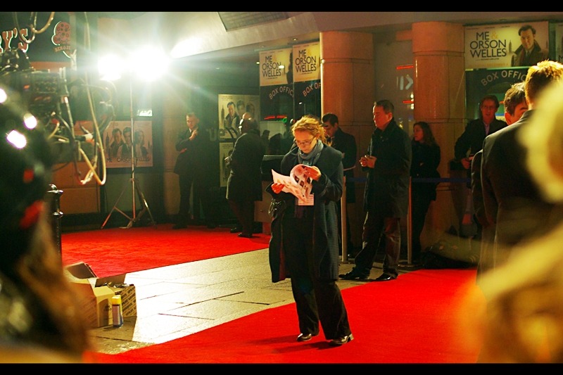 Here's a lady checking out The List of expected attendees, and. I use the opportunity to check my status. Position in crowd fairly close to front? Check. Spare battery for camera? Check. Empty memory Card? Check. And finally…cripplingly bright light shining directly into camera? … yeah. That too.